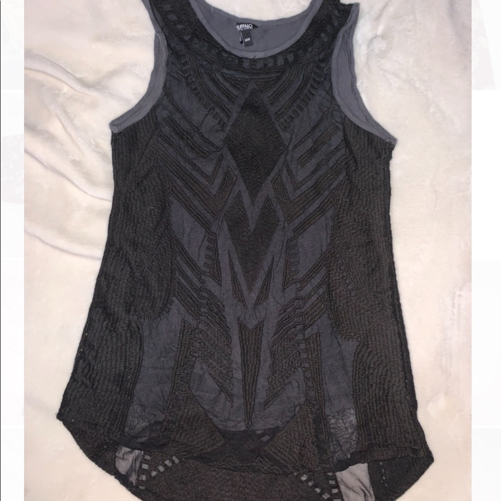 Black mesh overlay pattern layered on gray top